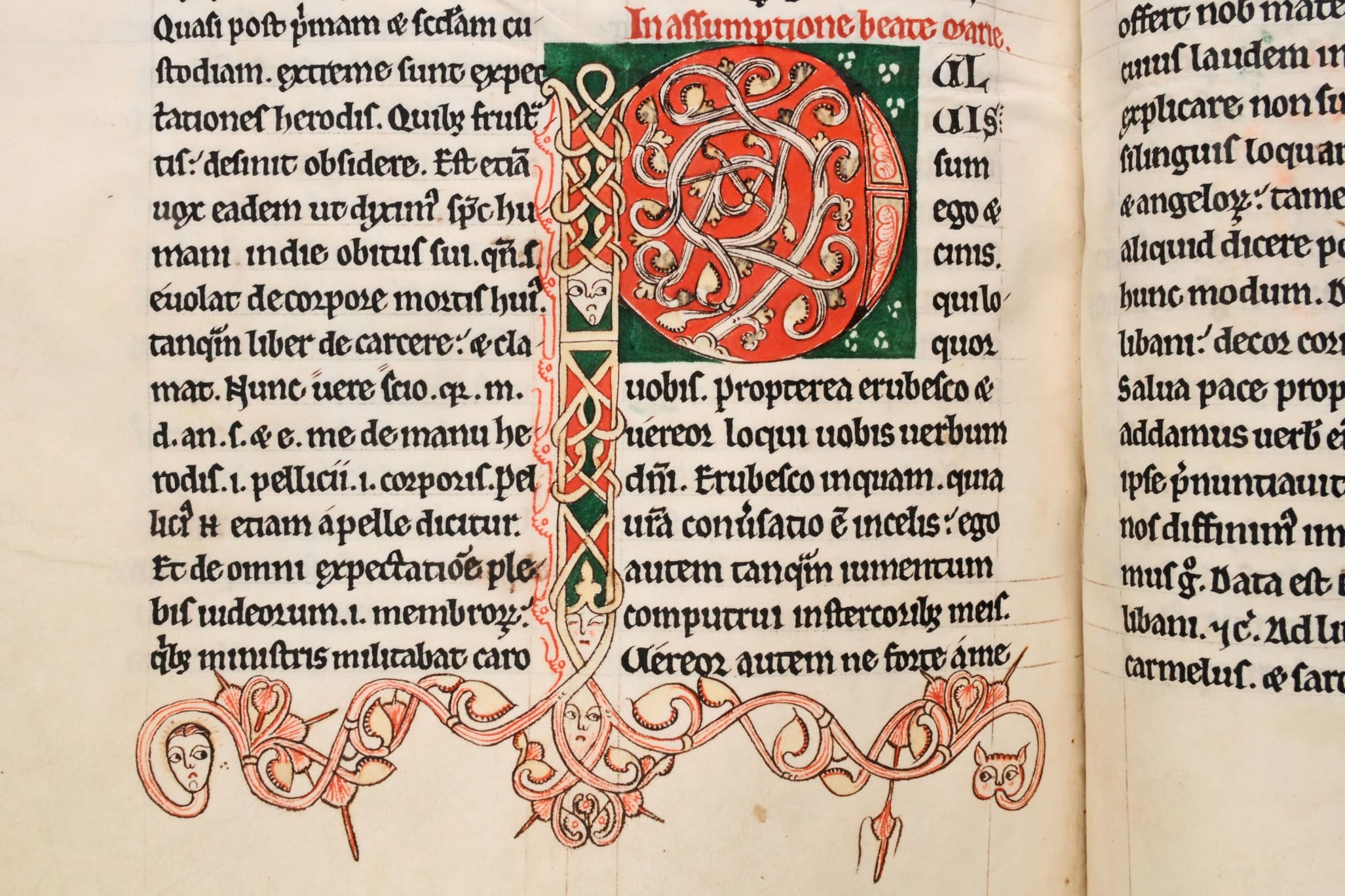 •	Part of a page of a medieval manuscript, with a large decorated initial letter P, coloured in red and green.